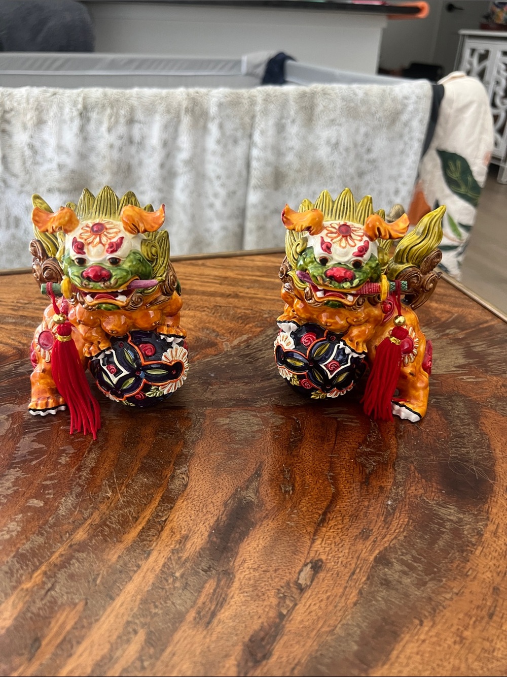 Two Chinese guard dogs very colorful- probably 25 years old- removal swords
